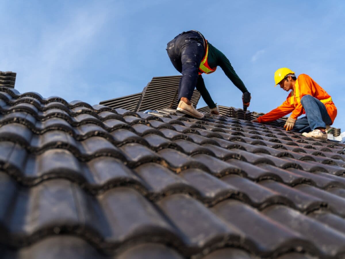 RoofingCorp roofer completing a roof repair in Sydney