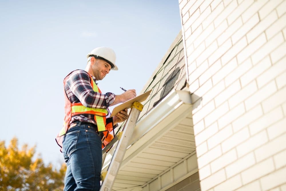 RoofingCorp roofer inspecting a Sydney roof for a condition report